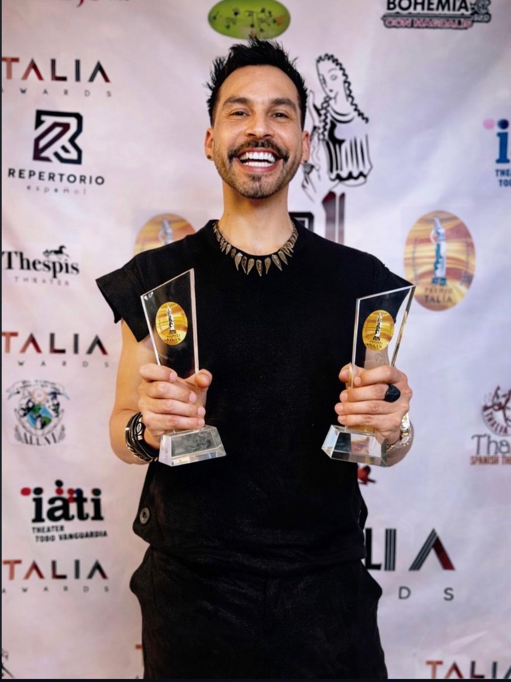 Charlie Zen, founder of El Vicio Producciones, with awards from the New York Latino theatre circuit